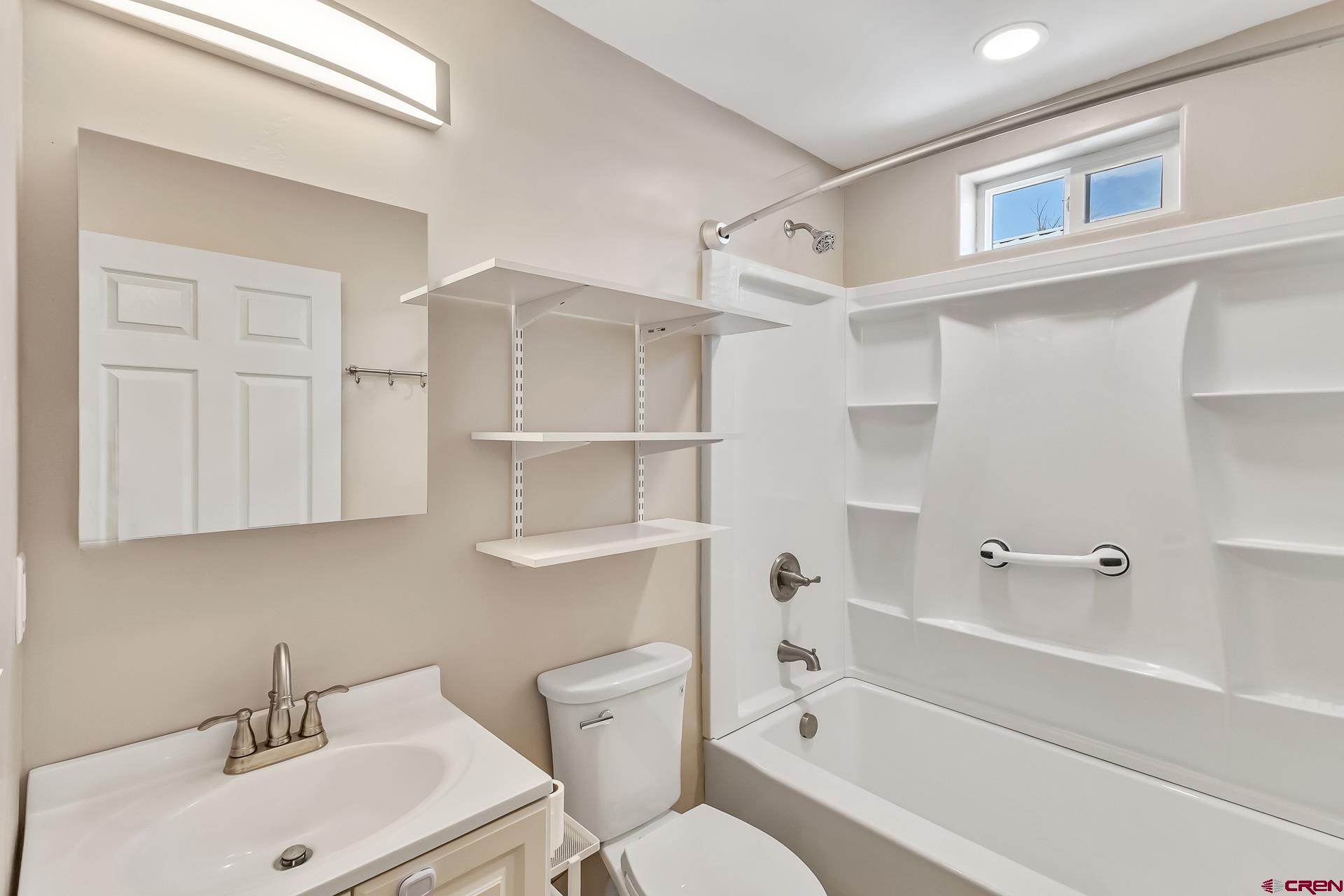 727 1550th Road Delta, CO 81416 - Photo 36 of 43 a bathroom with a sink toilet vanity and bathtub