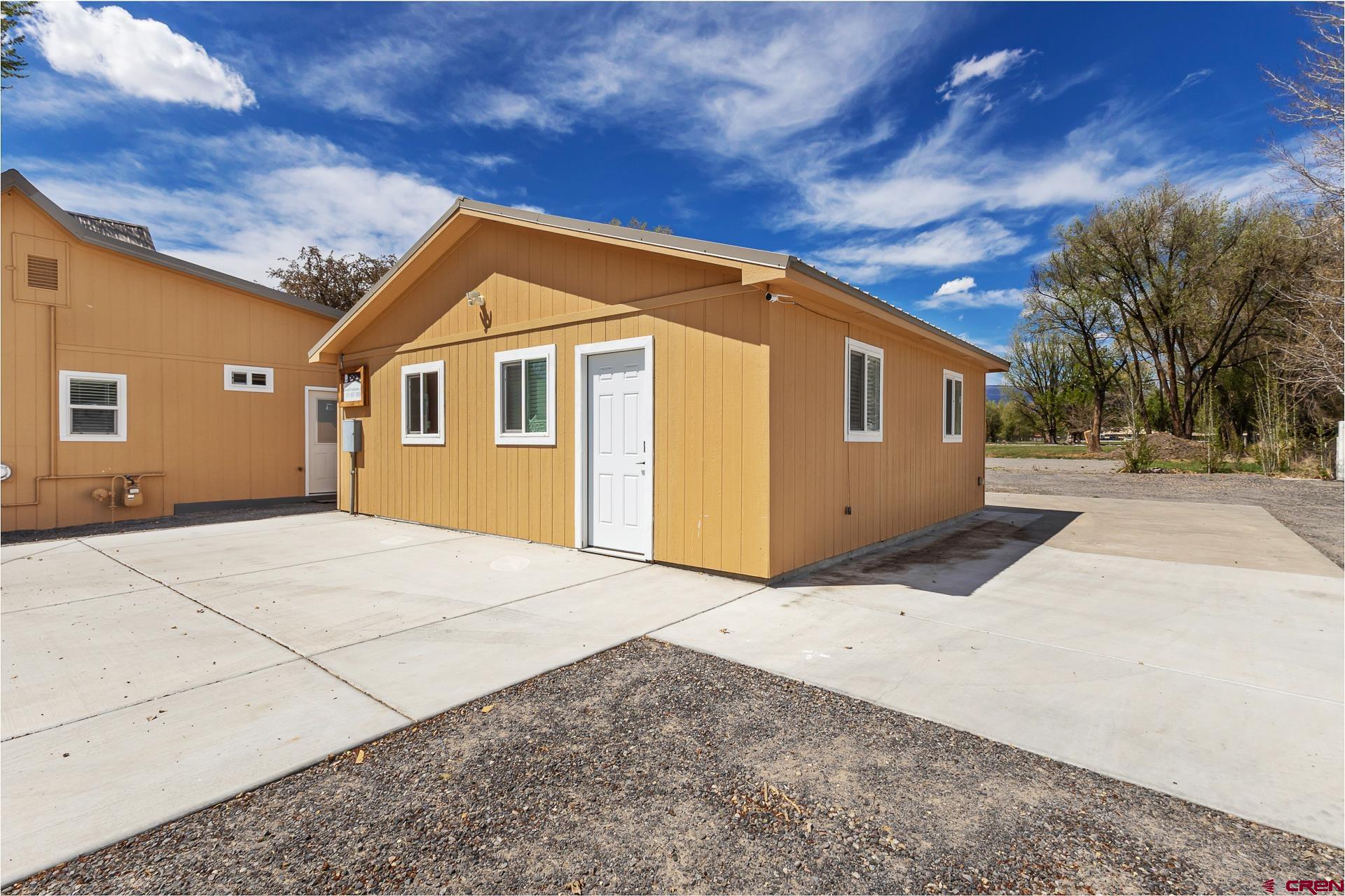 727 1550th Road Delta, CO 81416 - Photo 4 of 43 a front view of a house with a yard