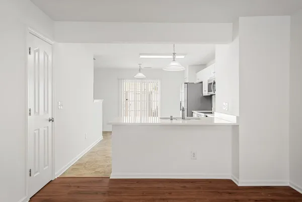 a view of kitchen with wooden floor