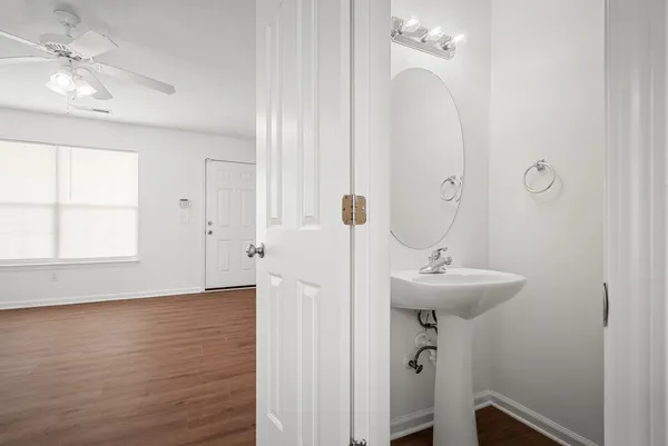 a bathroom with a sink a mirror and a shower