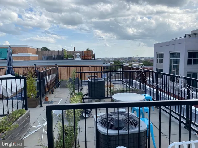 a view of a balcony with furniture