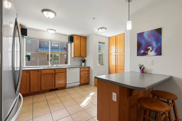 a kitchen with stainless steel appliances granite countertop a stove sink and microwave