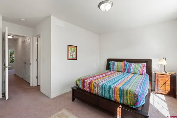 a room with a bed and a window