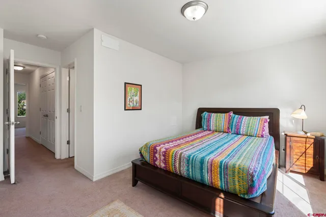 a room with a bed and a window