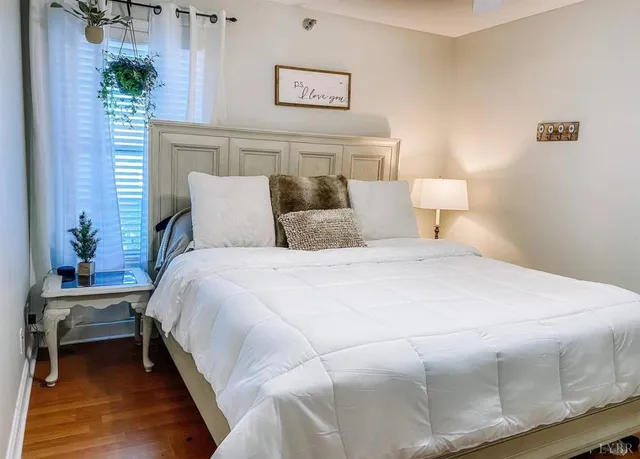 a large white bed in a white room