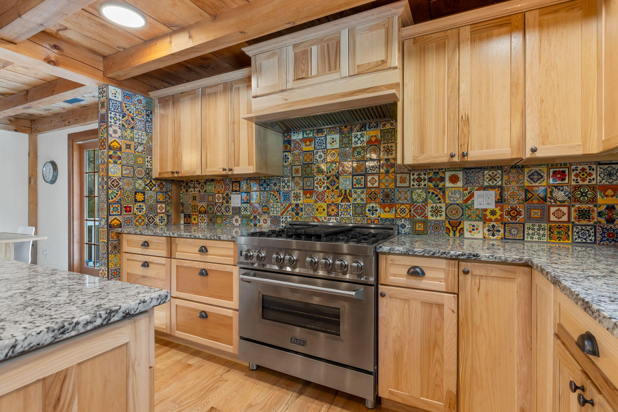 97 Round Cove Road Chatham, MA 02633 - Photo 19 of 55 a kitchen with granite countertop a stove sink and cabinets