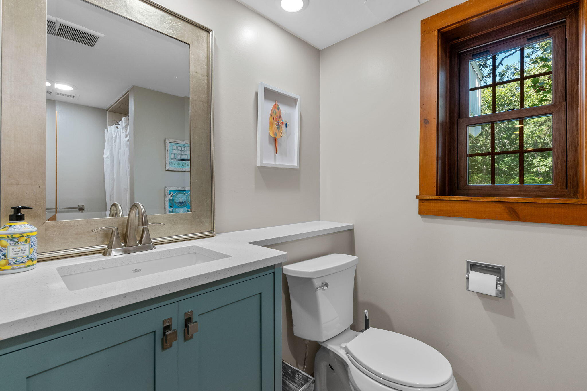 97 Round Cove Road Chatham, MA 02633 - Photo 38 of 55 a bathroom with a toilet a sink a mirror and window