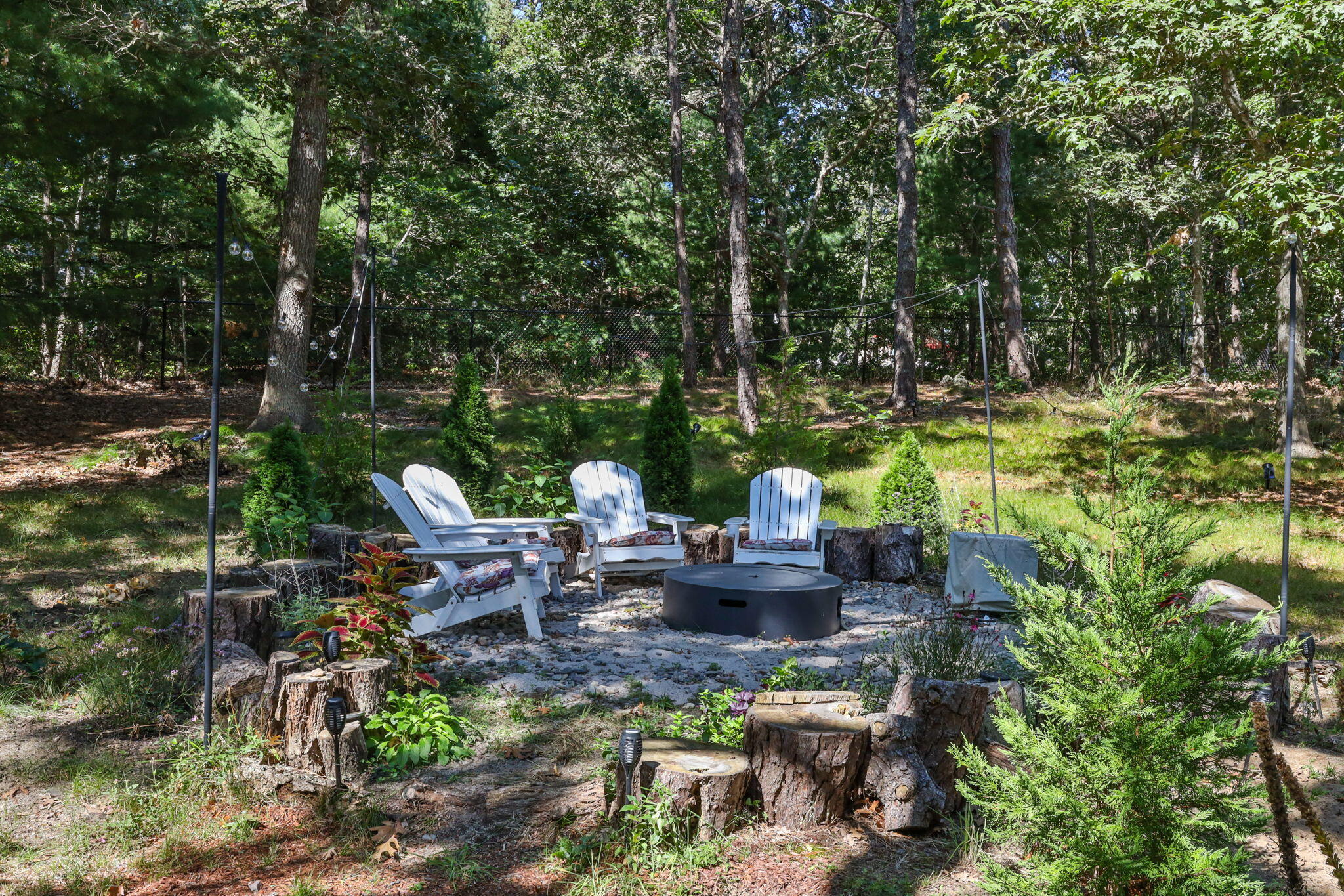 97 Round Cove Road Chatham, MA 02633 - Photo 43 of 55 a view of a chair and table in the garden