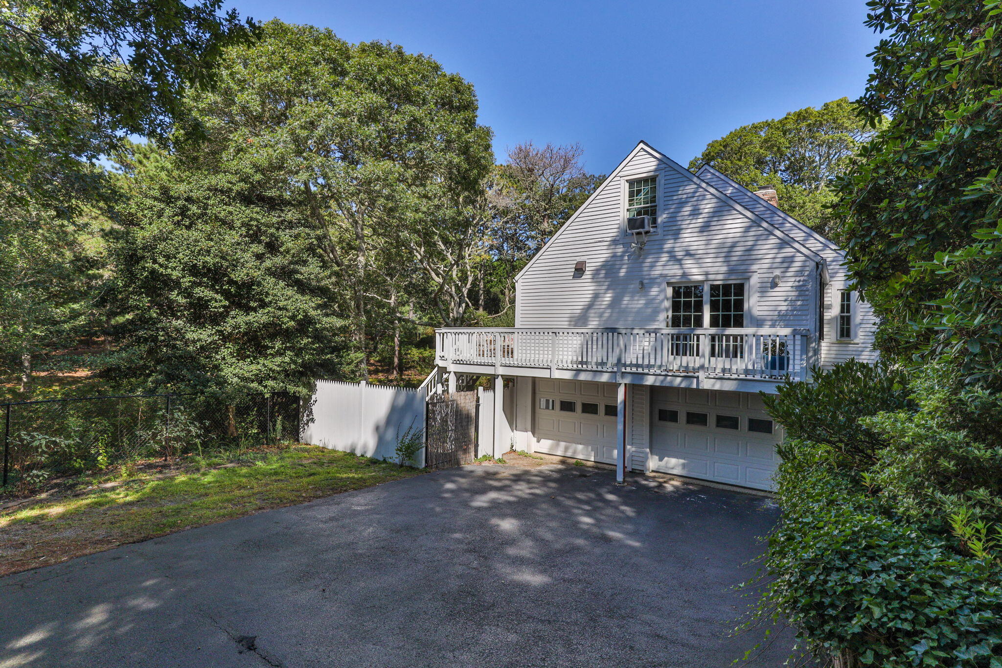 97 Round Cove Road Chatham, MA 02633 - Photo 49 of 55 a view of a house with a yard and tree s