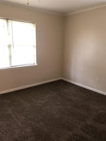a view of empty room with closet