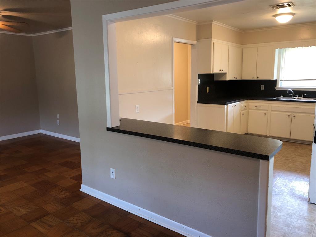 2722 Bolch Street Shreveport, LA 71104 - Photo 3 of 13 a view of a kitchen with wooden floor