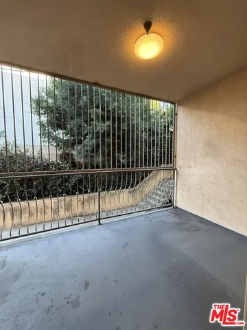 a view of a room with a floor to ceiling window