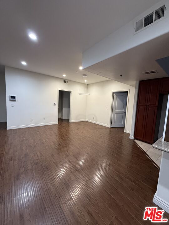 962 Gramercy Drive, Unit 102 Los Angeles, CA 90019 - Photo 12 of 20 a view of an empty room with wooden floor