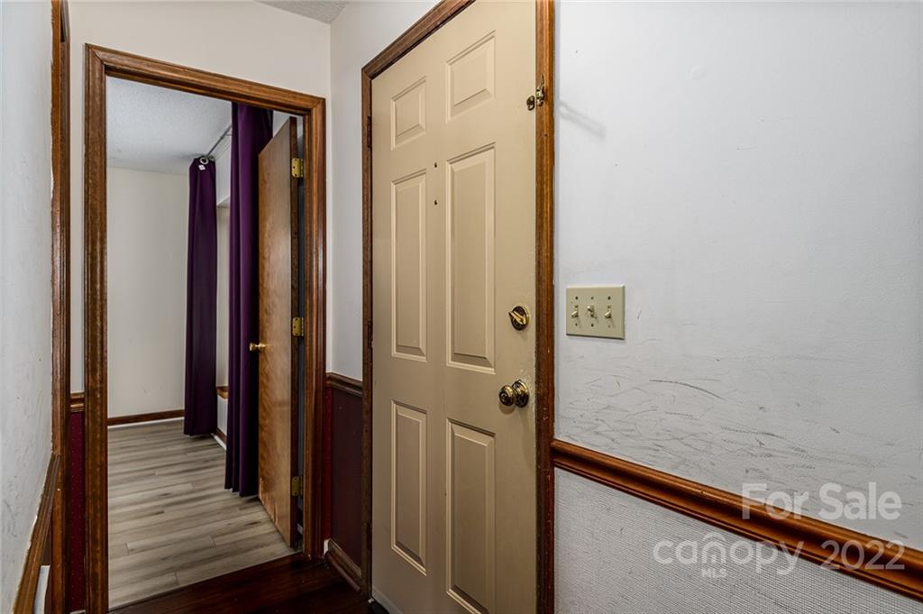 6199 Timberlane Terrace Hickory, NC 28601 - Photo 13 of 20 a view of a hallway with wooden floor and staircase