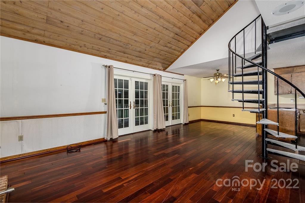 6199 Timberlane Terrace Hickory, NC 28601 - Photo 4 of 20 a view of an empty room with wooden floor and a window
