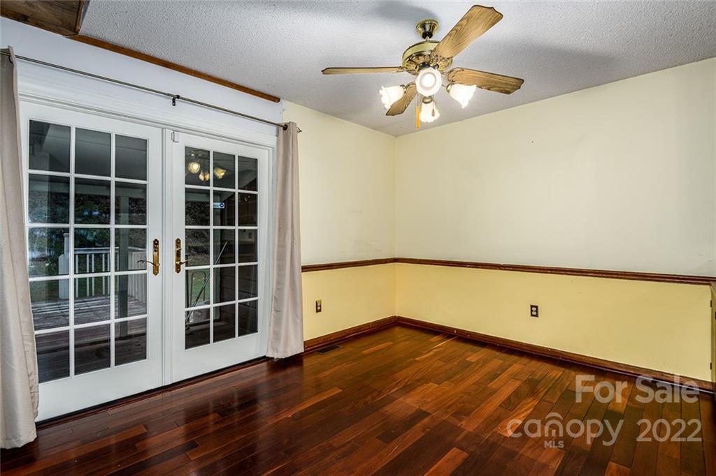 6199 Timberlane Terrace Hickory, NC 28601 - Photo 6 of 20 a view of a room with wooden floor and a large window