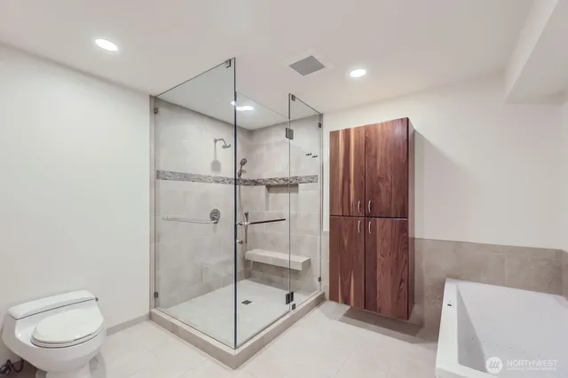 a bathroom with a bathtub and a sink