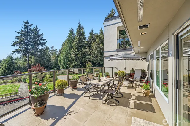 a view of a patio with a table and chairs