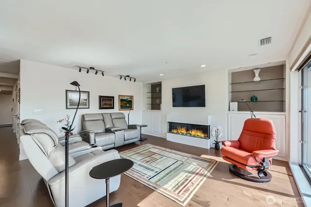 a living room with furniture or flat screen tv and a fireplace