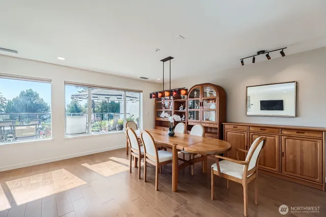 a view of a dining room with furniture window and outside view