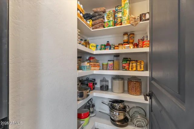 a shelf with cup and plates