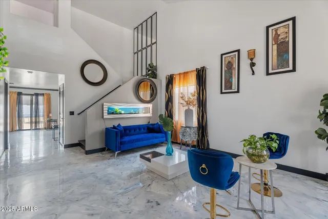 a living room with furniture and a table