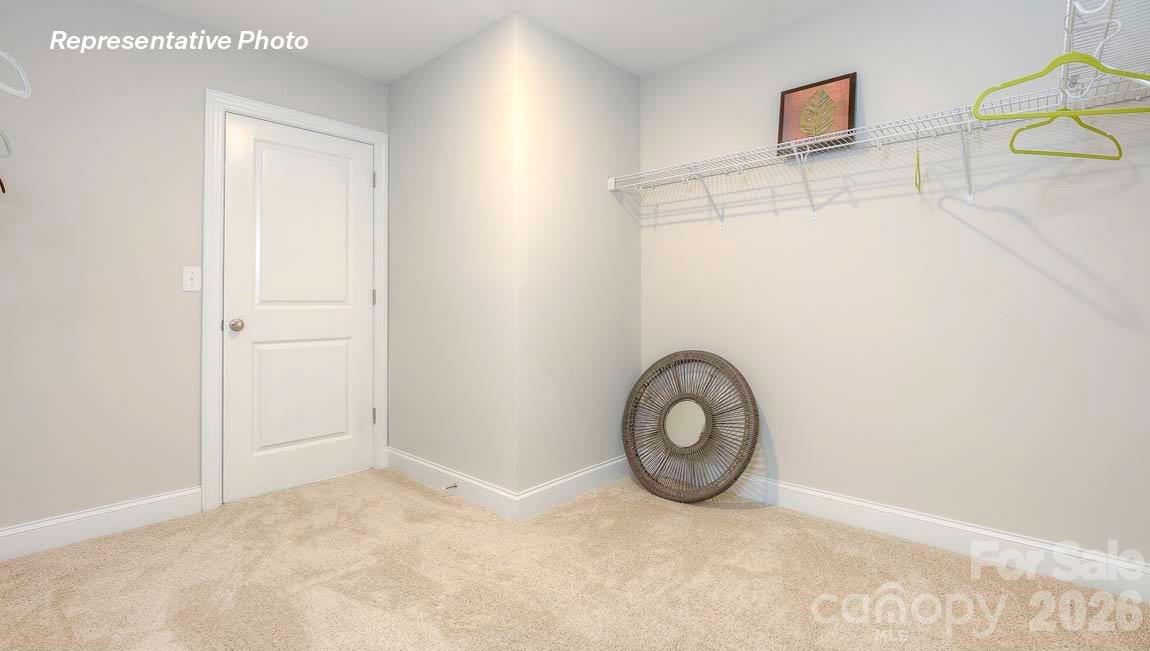3003 Eclipse Court Indian Trail, NC 28079 - Photo 38 of 48 a view of a room with wooden floor and white walls