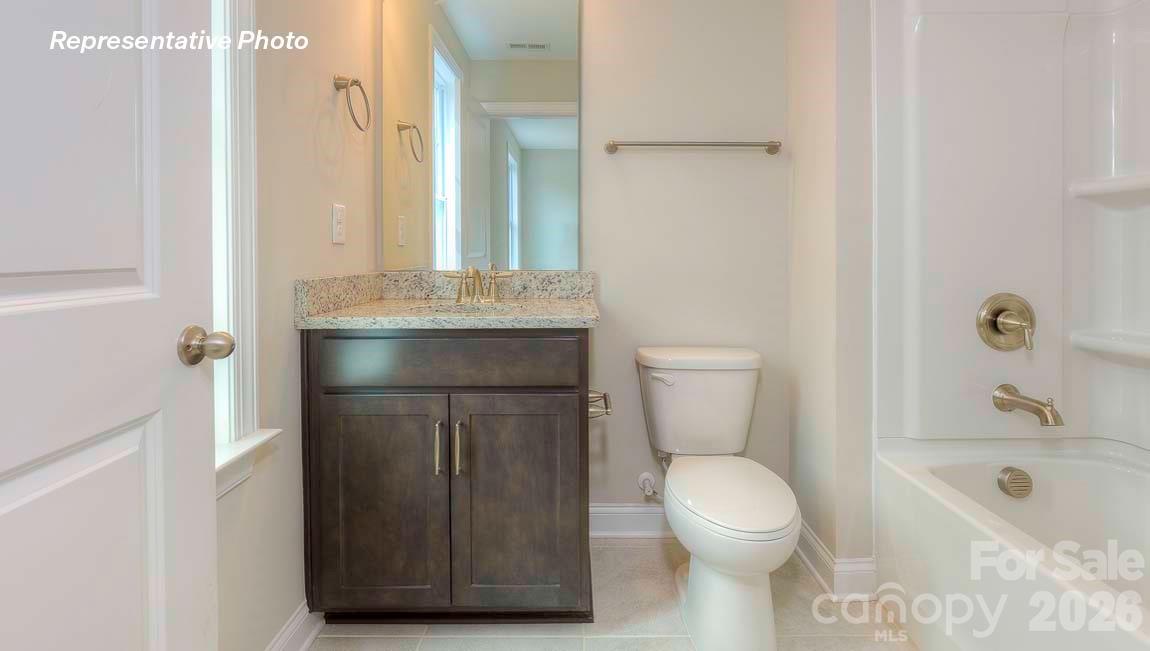 3003 Eclipse Court Indian Trail, NC 28079 - Photo 45 of 48 a bathroom with a sink a toilet and shower