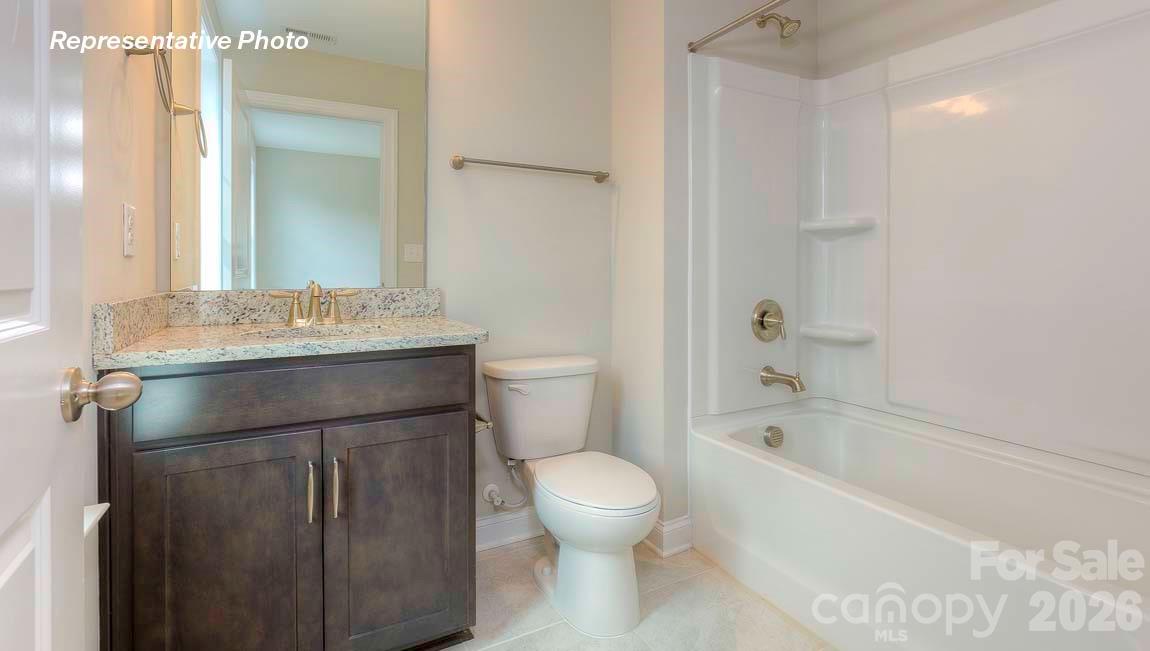 3003 Eclipse Court Indian Trail, NC 28079 - Photo 46 of 48 a bathroom with a sink toilet vanity and shower