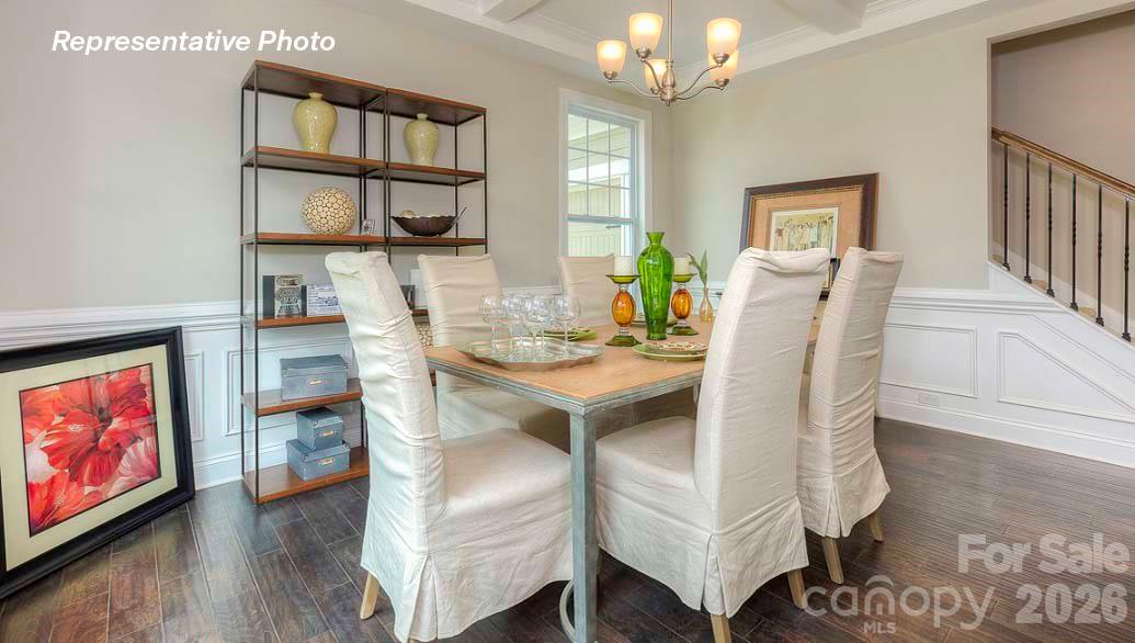 3003 Eclipse Court Indian Trail, NC 28079 - Photo 7 of 48 a view of a dining room with furniture and a chandelier