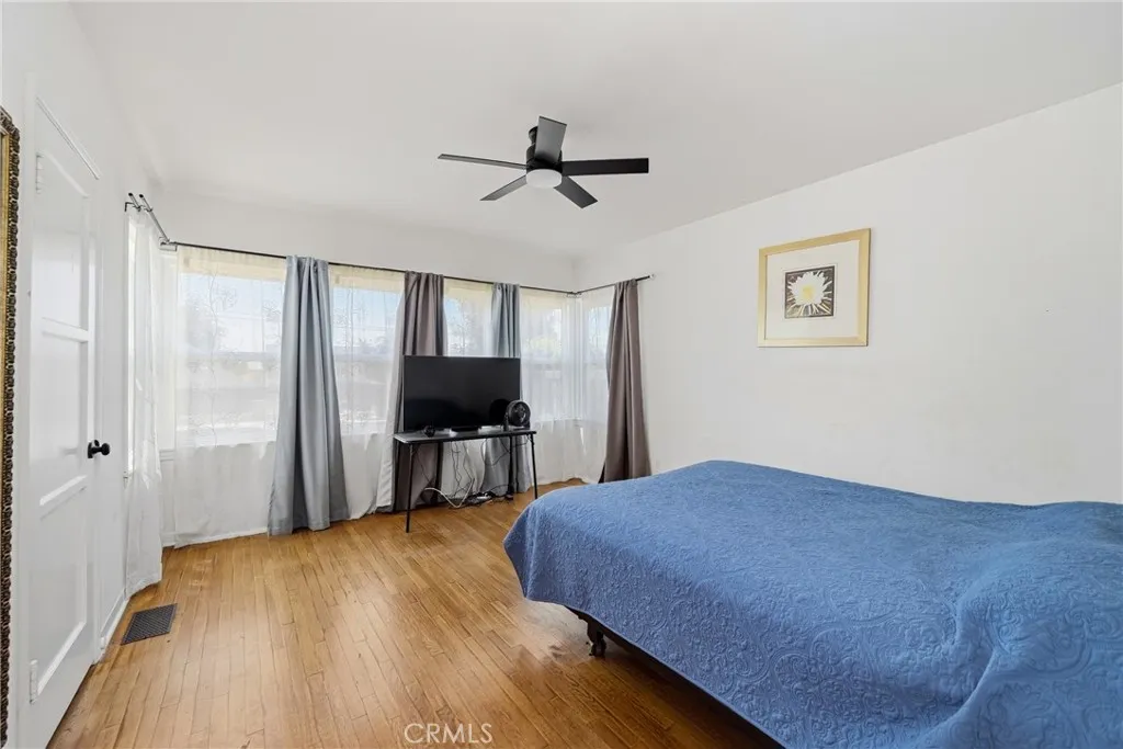 1770 Paloma Street Pasadena, CA 91104 - Photo 32 of 48 a bedroom with a bed and a flat screen tv