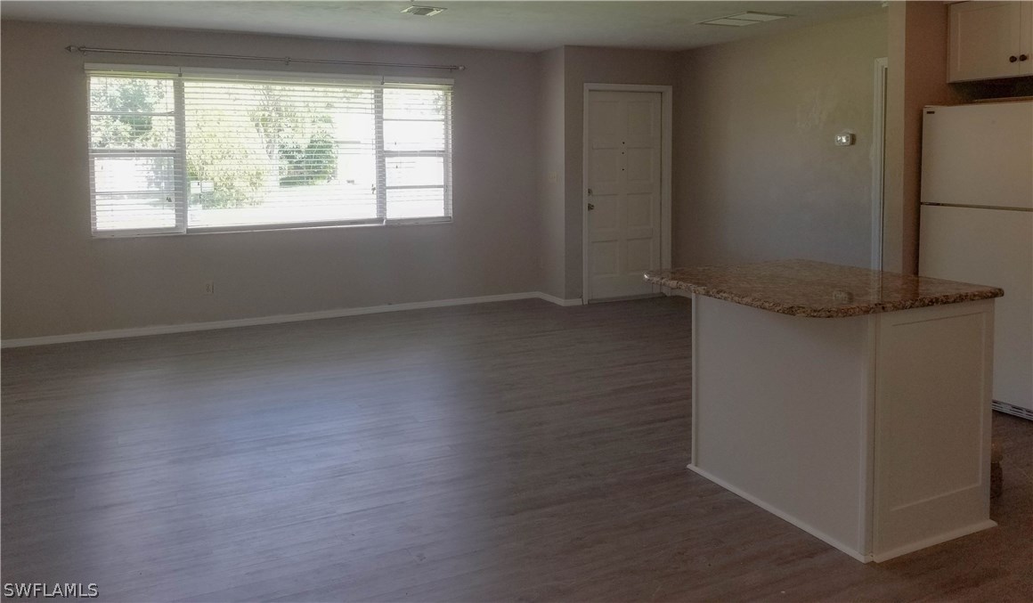 331 Delaware Road Lehigh Acres, FL 33936 - Photo 4 of 22 an empty room with a window