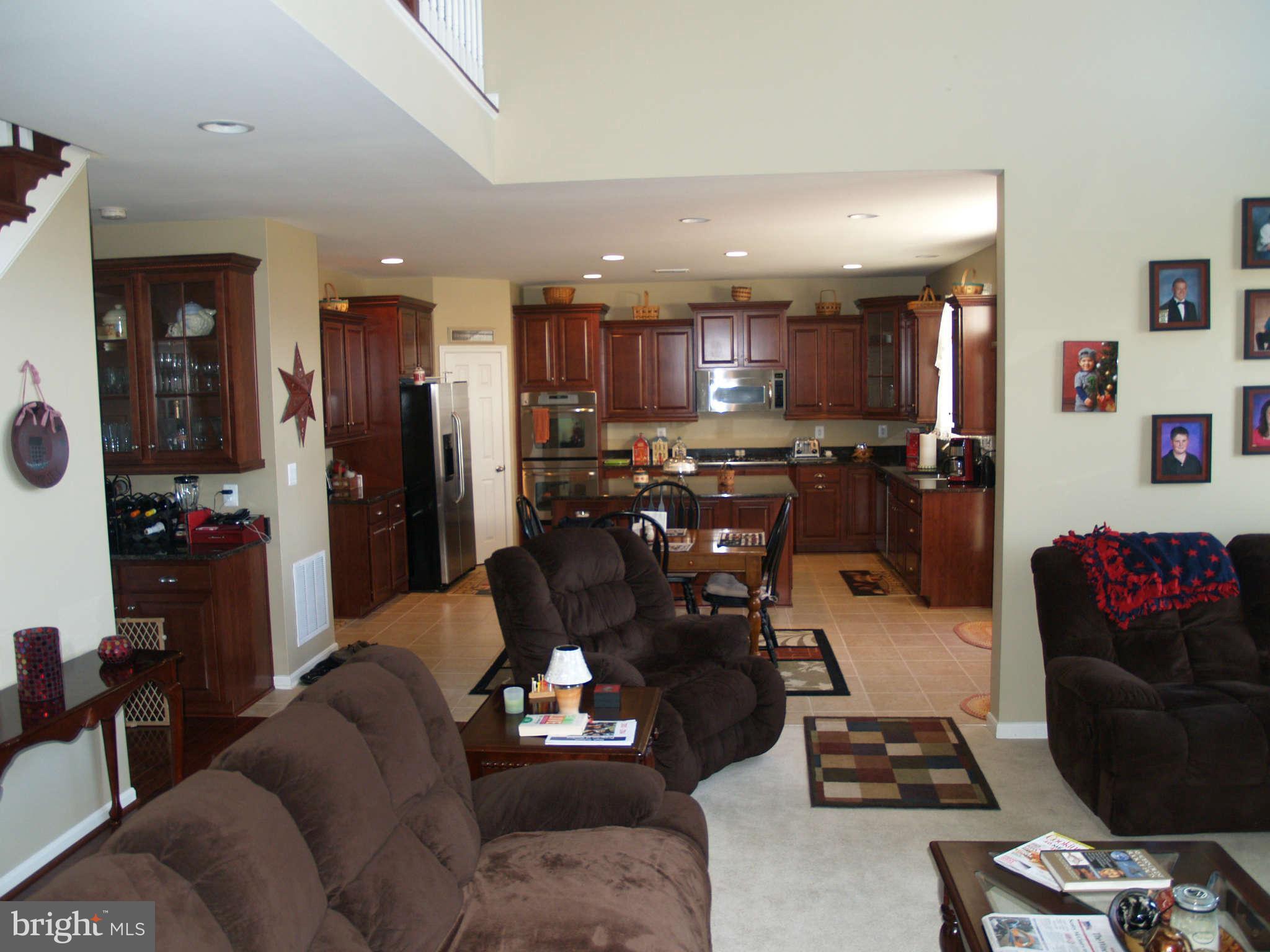 413 Woodrow Road Winchester, VA 22602 - Photo 8 of 25 family room and kitchen