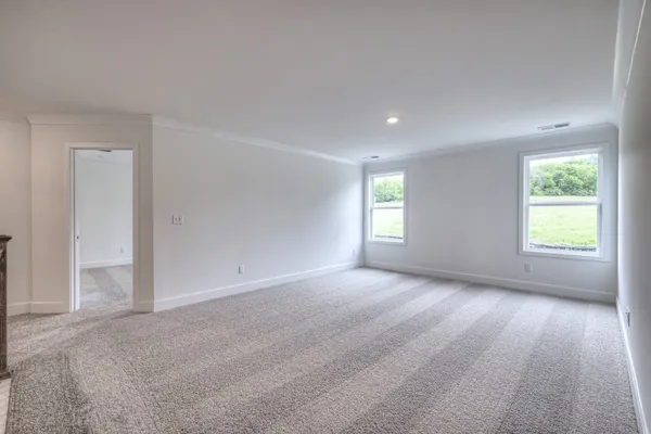 a view of a hallway with windows