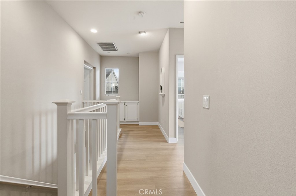 76 Kyle Court Ladera Ranch, CA 92694 - Photo 19 of 60 a view of a hallway with a sink