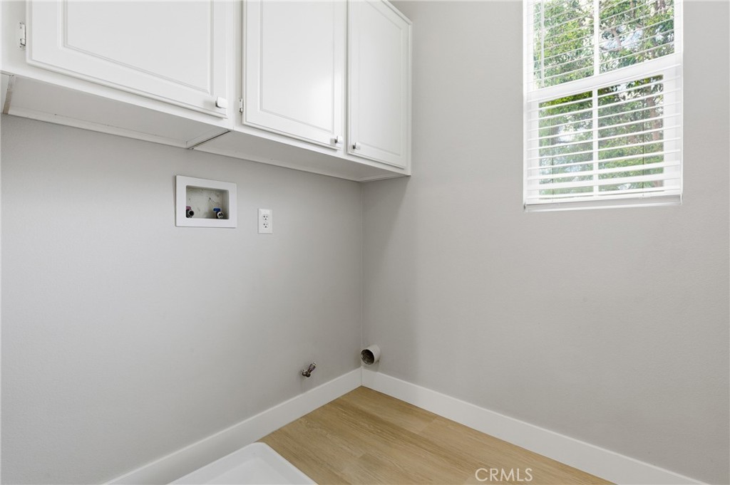 76 Kyle Court Ladera Ranch, CA 92694 - Photo 20 of 60 a view of a room with rack on the wall
