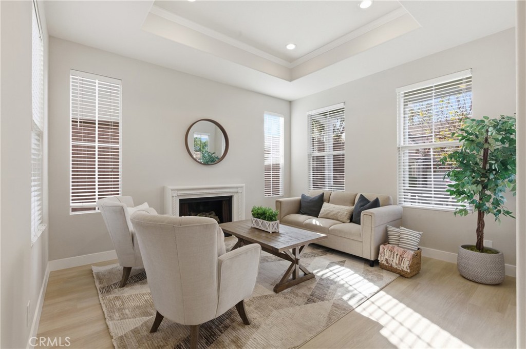 76 Kyle Court Ladera Ranch, CA 92694 - Photo 4 of 60 a living room with furniture a window and a fireplace