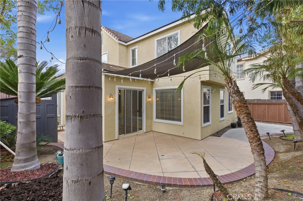 76 Kyle Court Ladera Ranch, CA 92694 - Photo 43 of 60 a view of a white house with a table and chairs