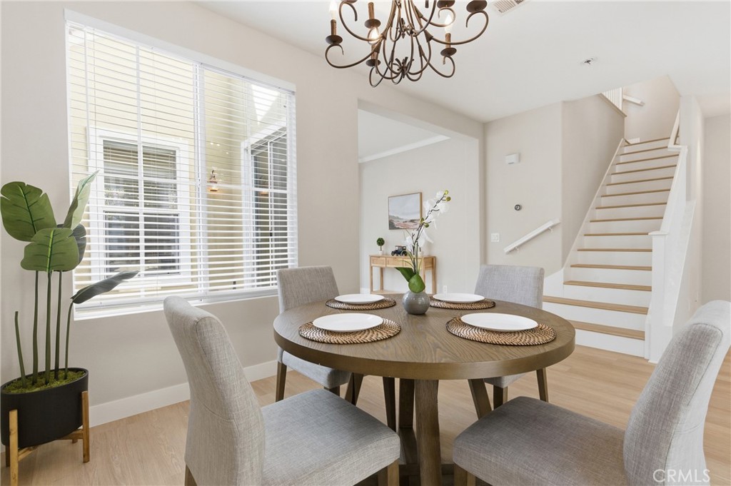 76 Kyle Court Ladera Ranch, CA 92694 - Photo 9 of 60 a view of a dining room with furniture window and wooden floor