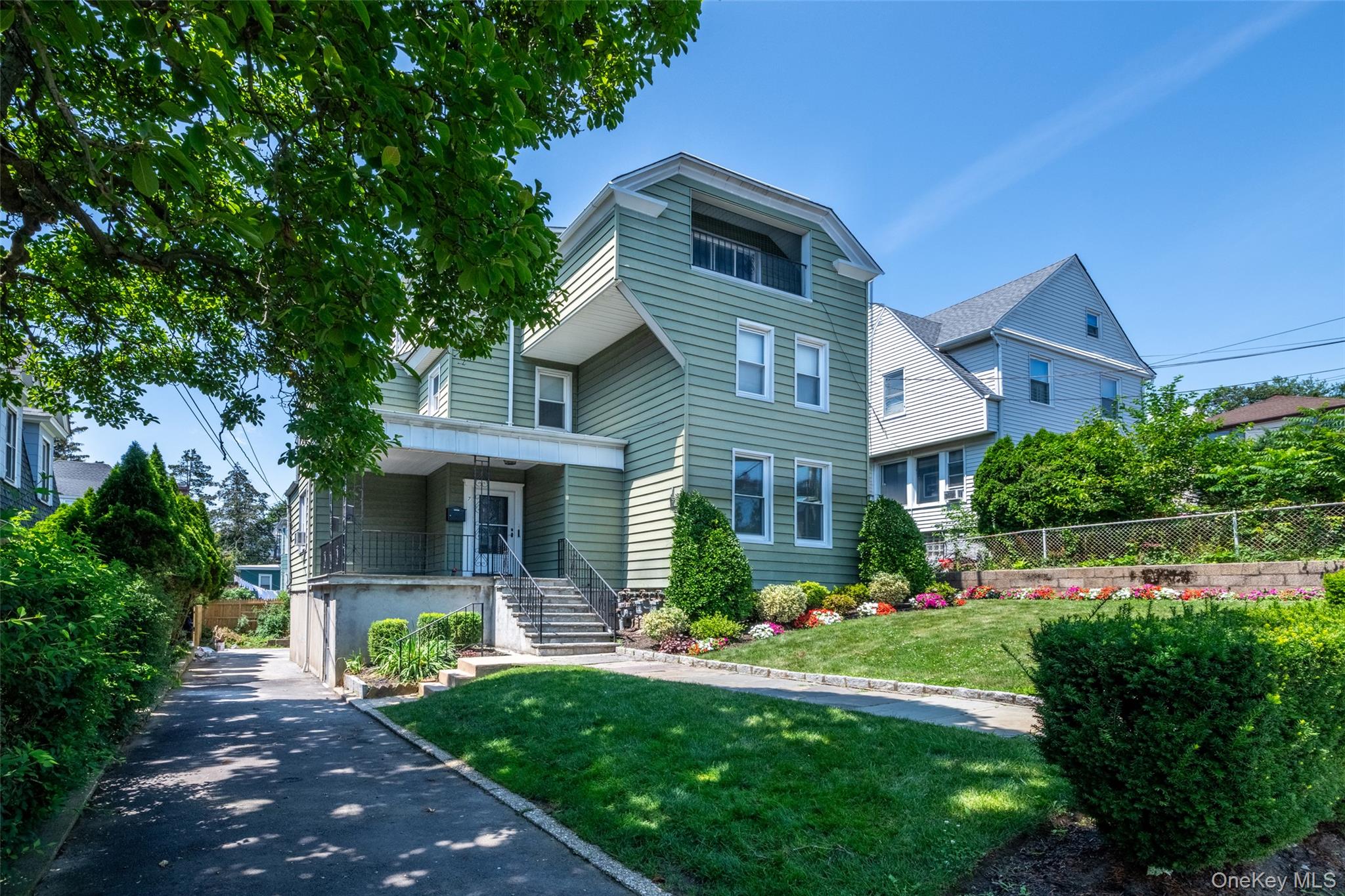 7 Alpha Place, Unit FIRST New Rochelle, NY 10805 - Photo 1 of 25 View of front of house with covered porch