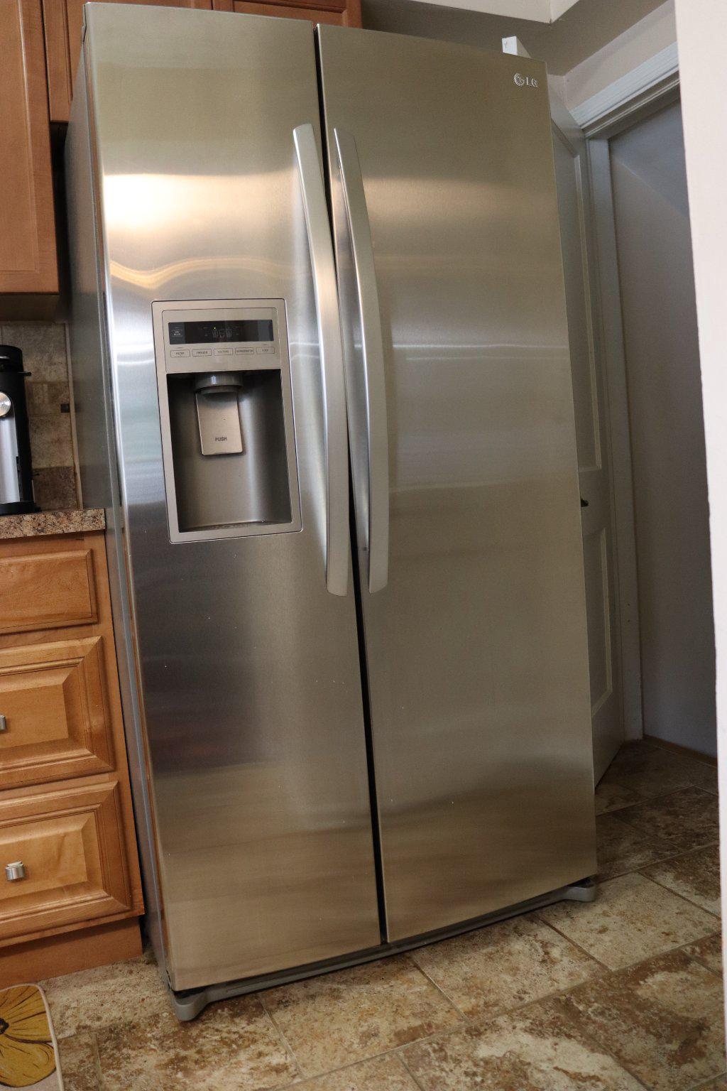 1328 Cedarcroft Road Baltimore, MD 21239 - Photo 28 of 39 Stainless steel LG fridge with water and ice.