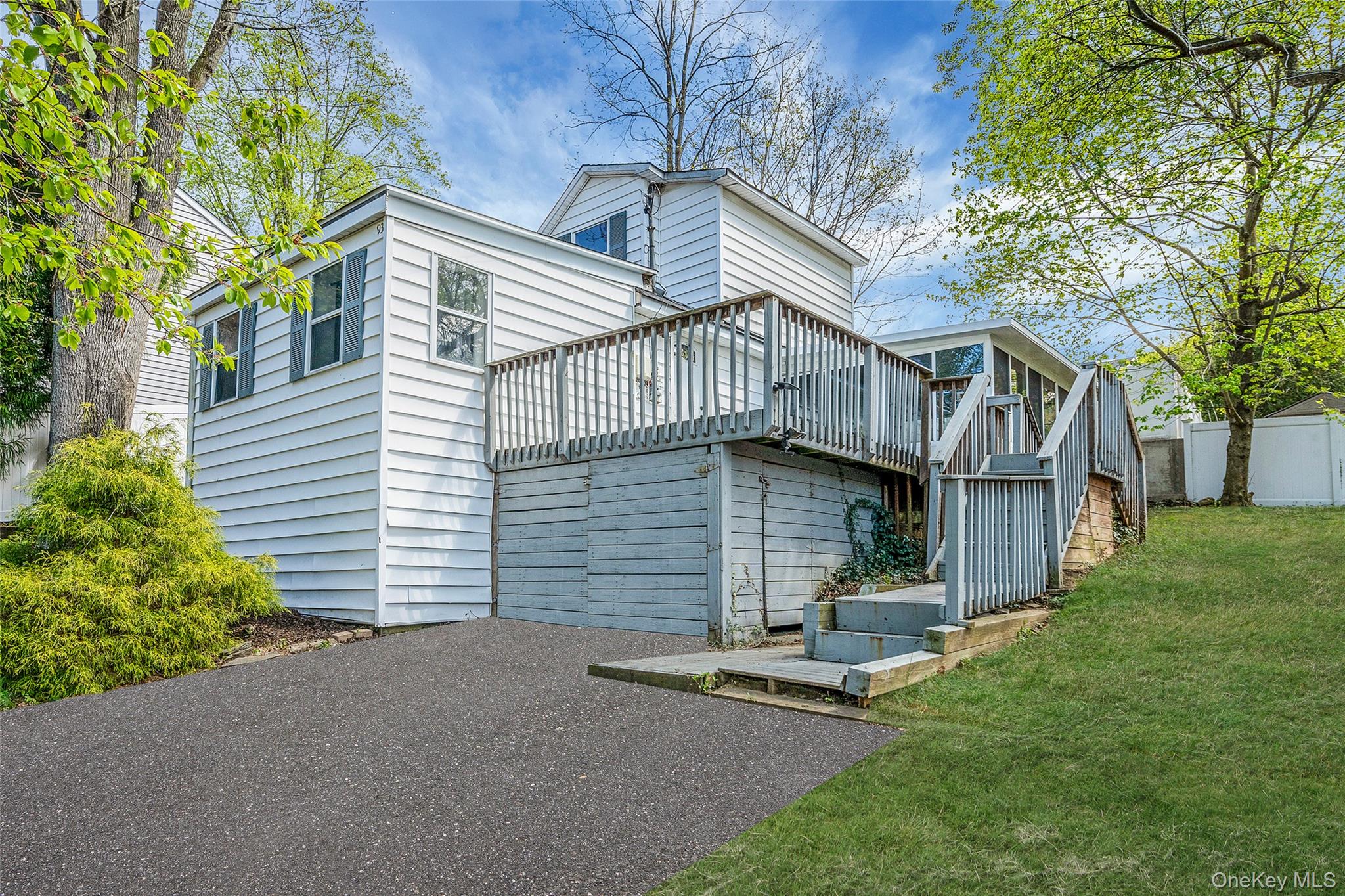 93 Maple Road Kings Park, NY 11754 - Photo 2 of 24 a view of a house with a yard and large tree