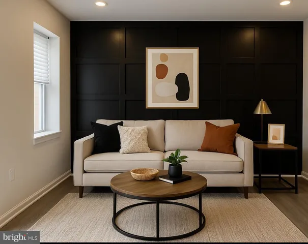 a living room with furniture and a lamp