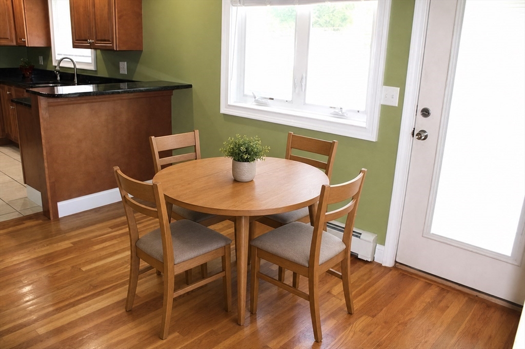 21 Whitcomb Drive Lancaster, MA 01523 - Photo 4 of 23 a view of a dining room with furniture and wooden floor