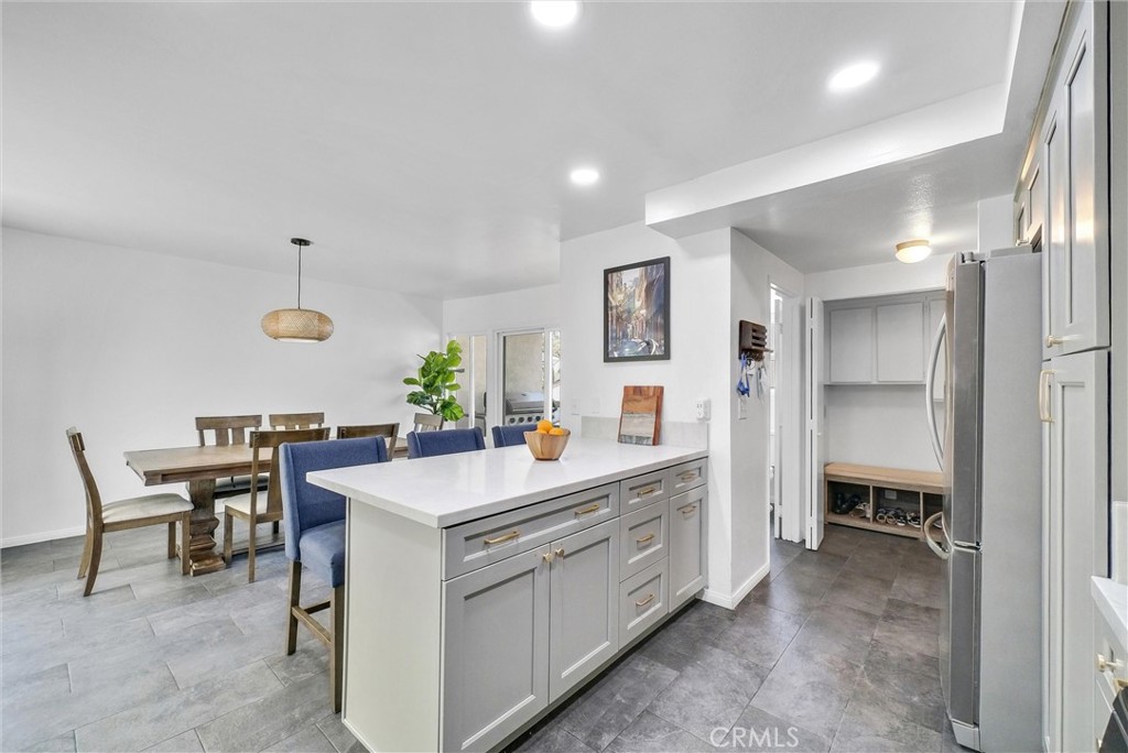 255 Scenic Way Brea, CA 92821 - Photo 12 of 57 a view of kitchen island with stainless steel appliances furniture a sink and a refrigerator