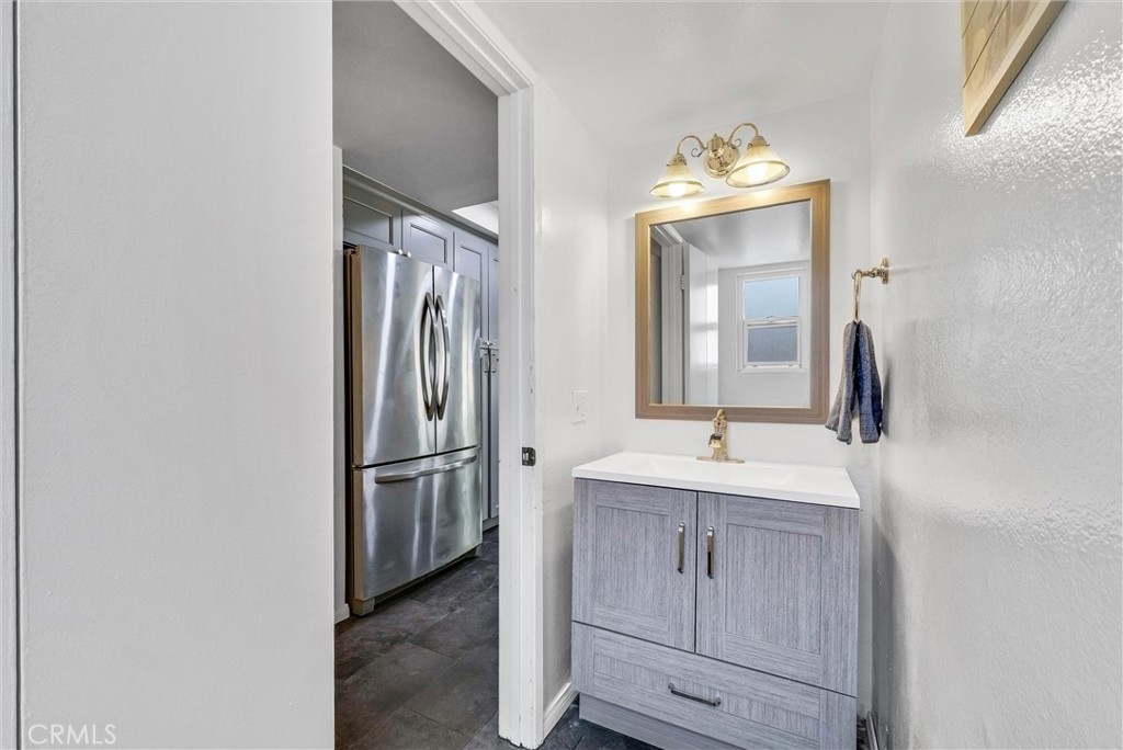 255 Scenic Way Brea, CA 92821 - Photo 17 of 57 a bathroom with a sink and a mirror
