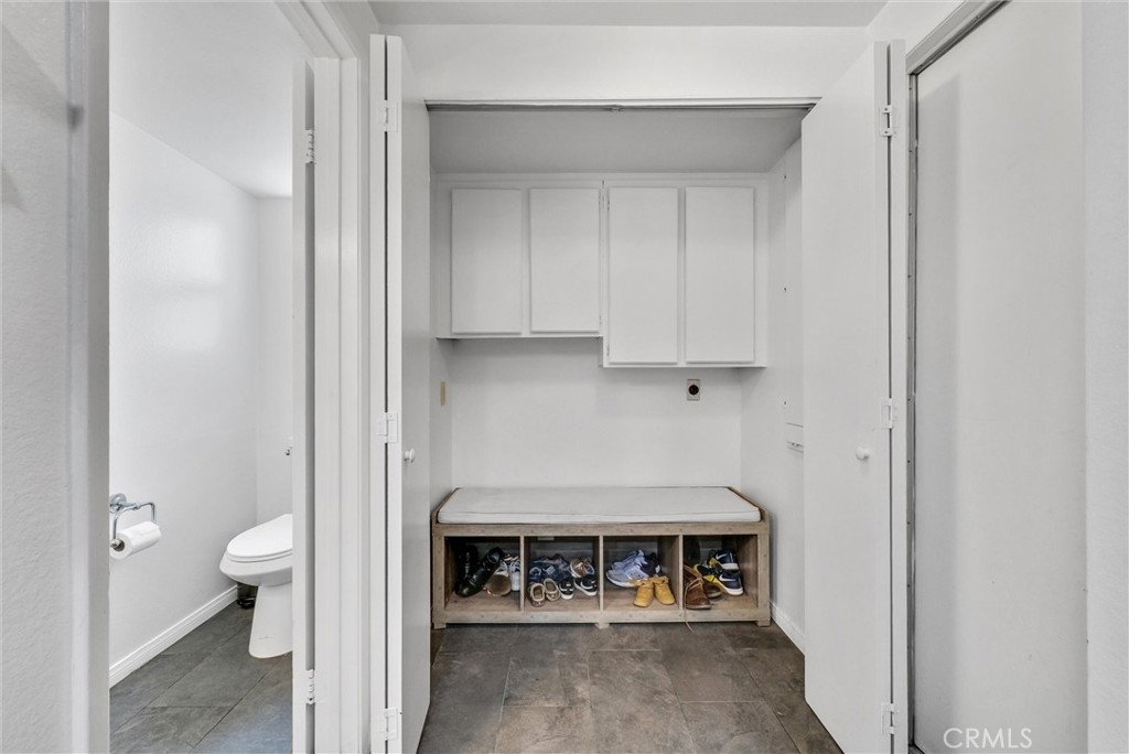 255 Scenic Way Brea, CA 92821 - Photo 21 of 57 a view of an empty room with a chair and a fireplace