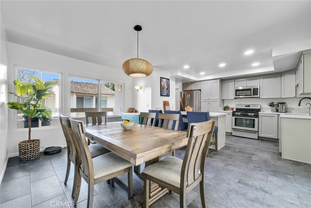 255 Scenic Way Brea, CA 92821 - Photo 3 of 57 a view of a dining room and livingroom with furniture wooden floor a chandelier