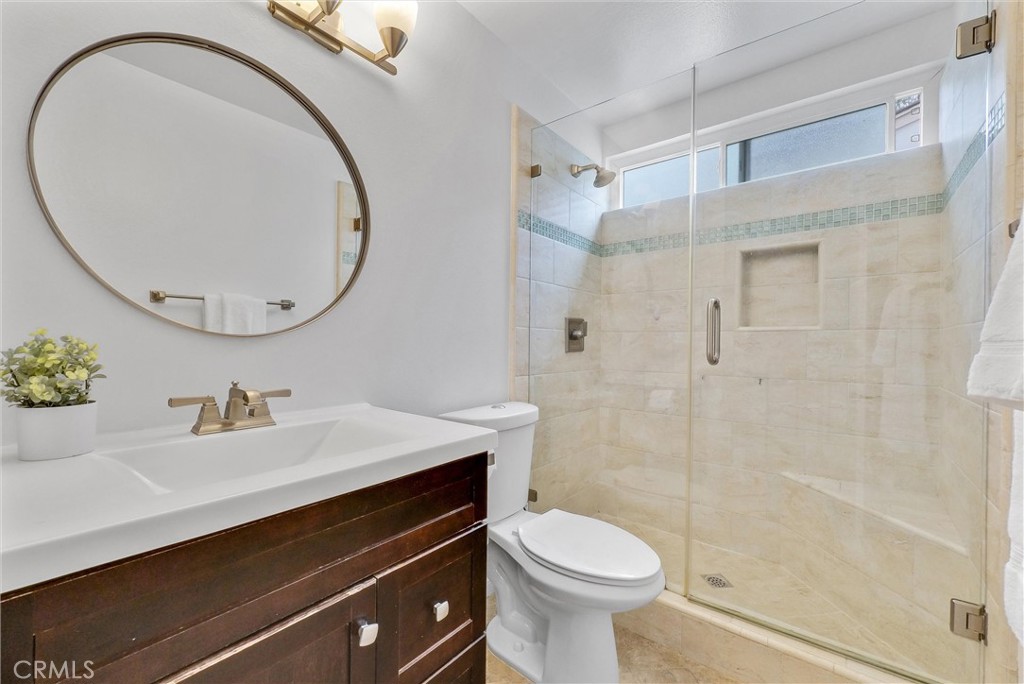 255 Scenic Way Brea, CA 92821 - Photo 35 of 57 a bathroom with a sink a toilet and a mirror