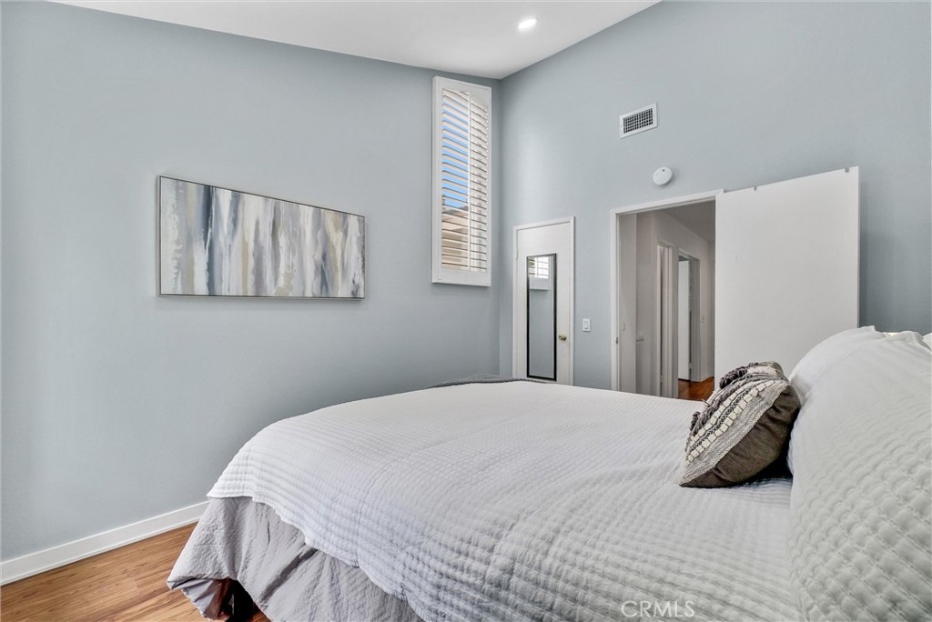 255 Scenic Way Brea, CA 92821 - Photo 37 of 57 a bedroom with a bed and wooden floor
